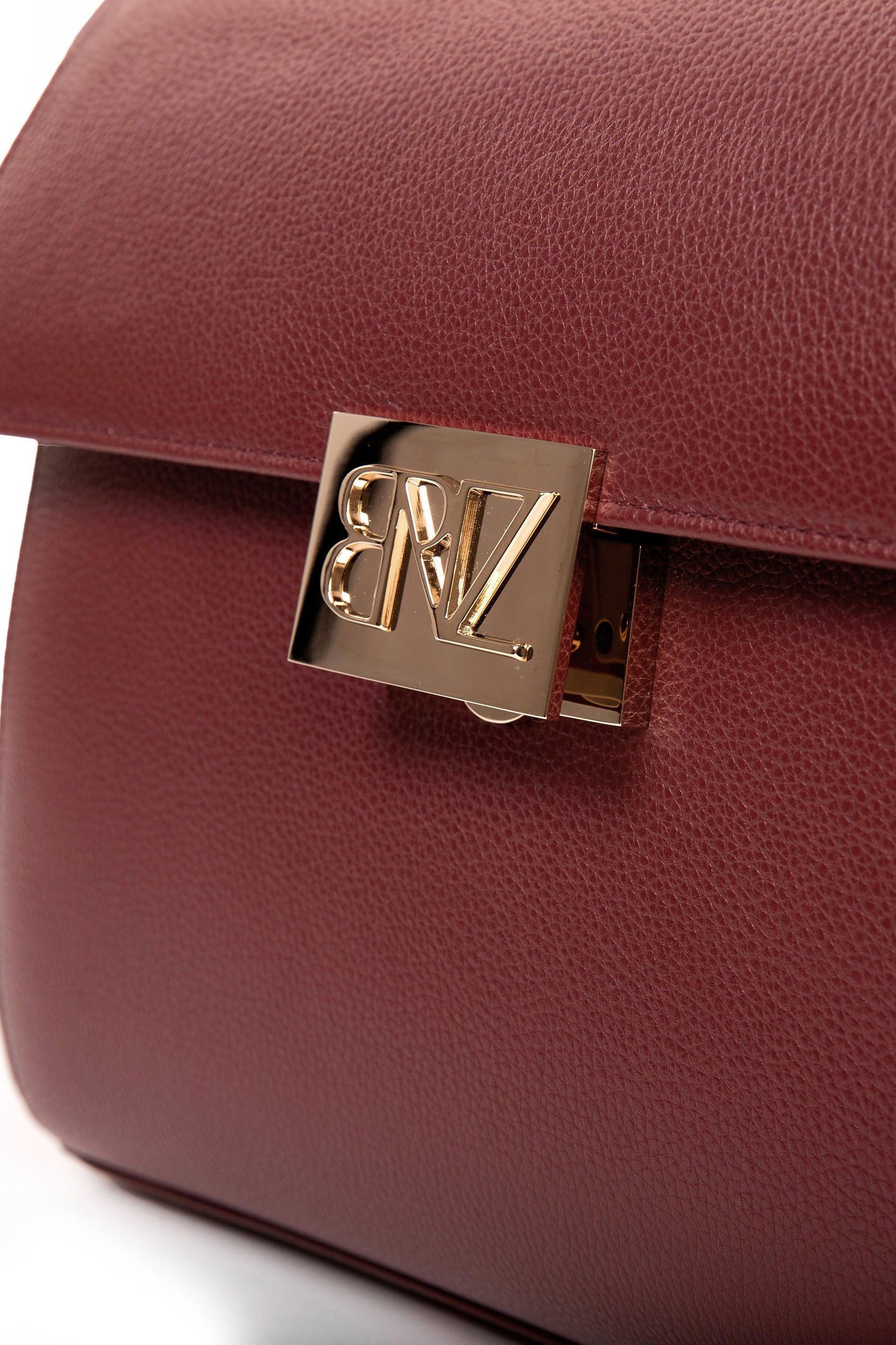 Akira bag - bordeaux calfskin leather - gold logo closure detail - Berénize